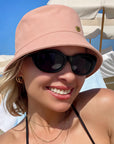 Velvet Trends Pink bucket hat on model