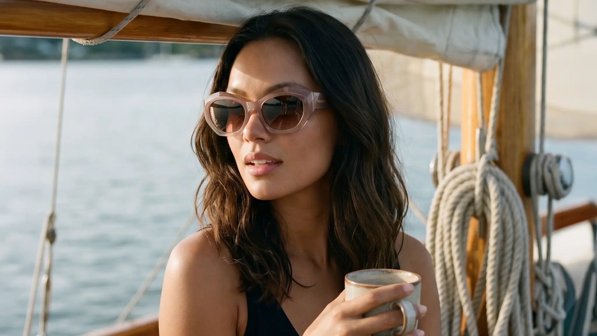Woman wearing blush polarized cat eye sunglasses by Velvet Eyewear designed for oval, heart and square face shapes