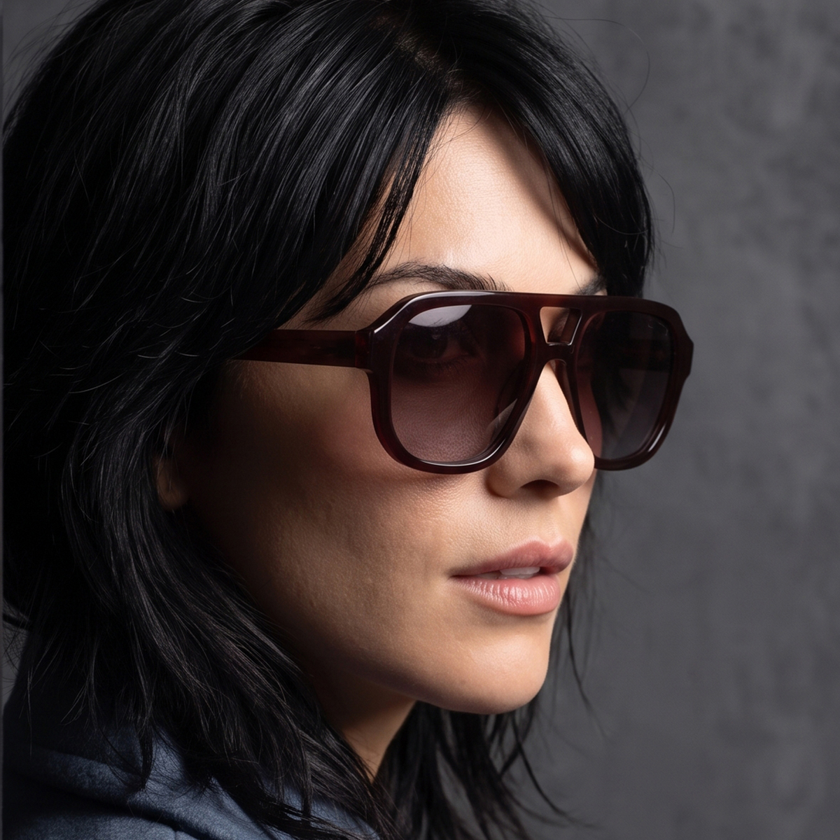 Model wearing the Dani color burgundy polarized sunglass style for Women by Velvet Eyewear. Best for Oval, Round, and Heart Face Shapes. Best for seasonal color palettes Summer, Autumn and Winter. Lifestyle image.