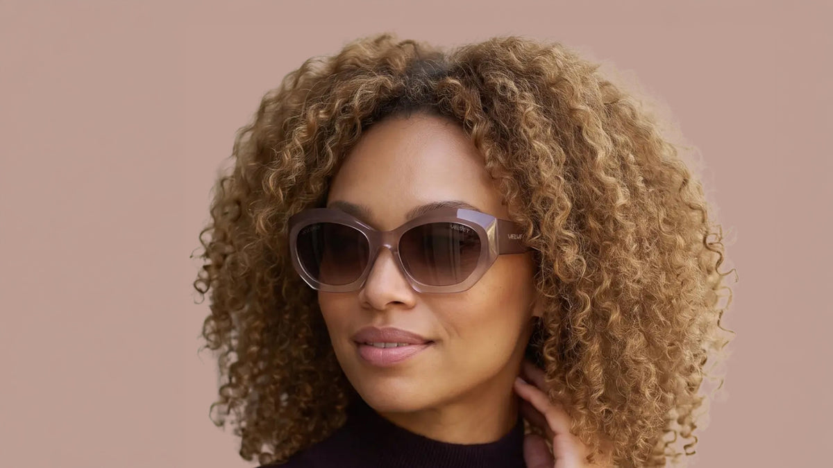 Velvet Eyewear® Alice polarized blush oversized sunglasses, wide portrait for heart face shapes and Spring, Summer and Autumn seasonal color palettes, worn by a model