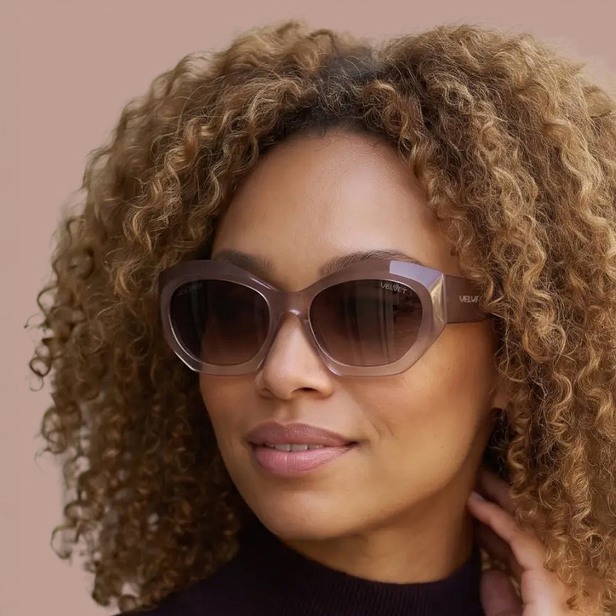 Velvet Eyewear® Alice polarized blush oversized sunglasses, square portrait for heart face shapes and Spring, Summer and Autumn seasonal color palettes, worn by a model