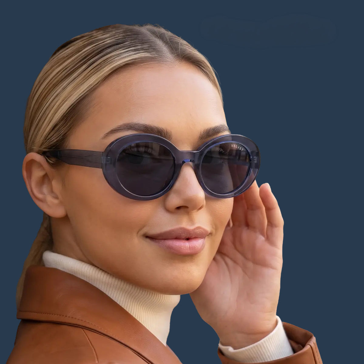 Velvet Eyewear® Iris polarized navy round-oval sunglasses, square portrait for oval face shapes and all seasonal color palettes, especially Summer, worn by a model
