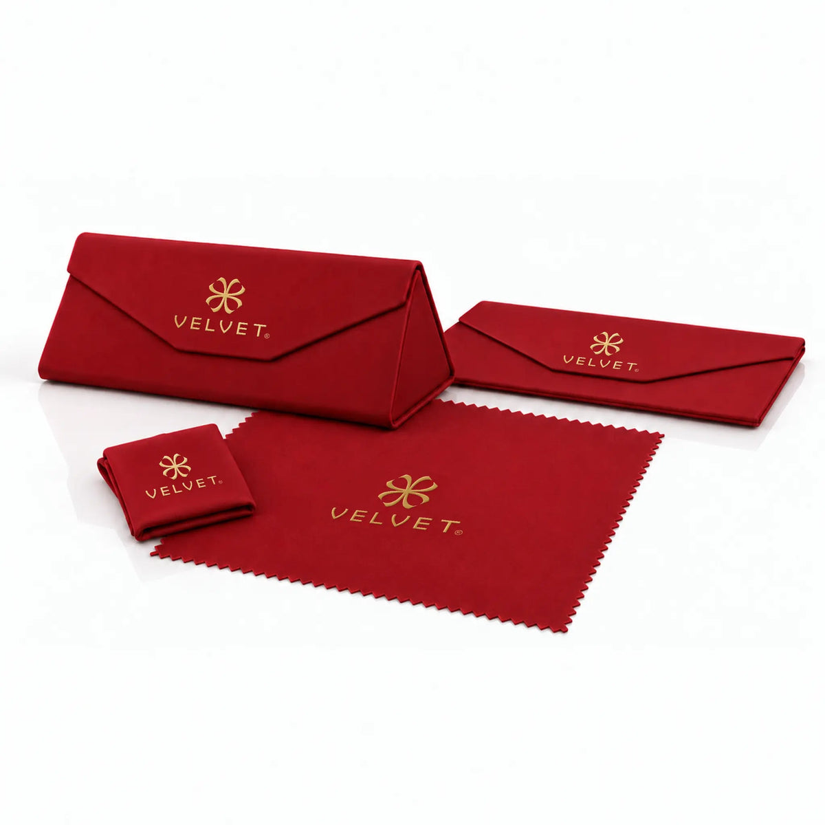 Velvet Eyewear red folding hard case shown assembled and folded flat, with a red cleaning cloth shown folded and unfolded, all with gold Velvet branding.