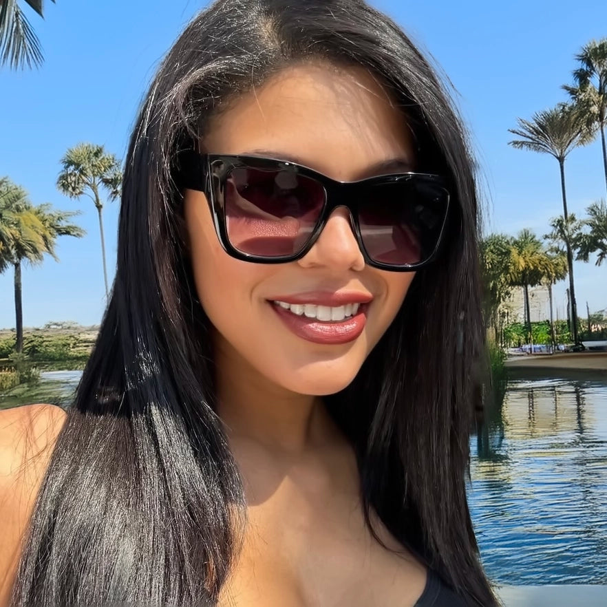 Woman wearing classic oversized sunglasses by Velvet Eyewear designed for an oval face shape