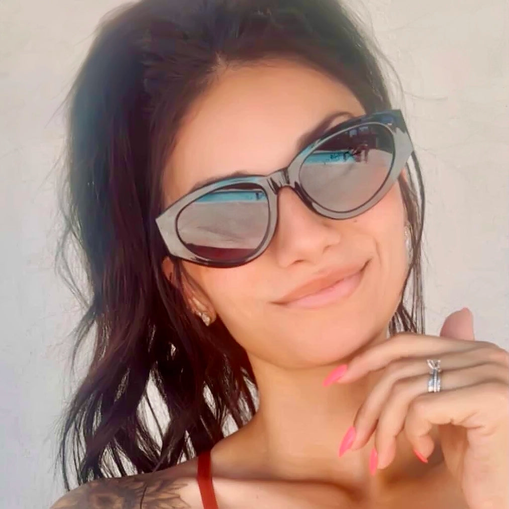 Woman wearing soft rounded sunglasses by Velvet Eyewear designed for a square face shape