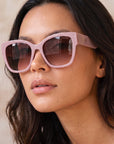 Jane by Velvet Eyewear. Polarized sunglass in lavender. Designed for Oval, Square, and Heart Face Shapes. Great for all seasonal color palettes. Model photo.