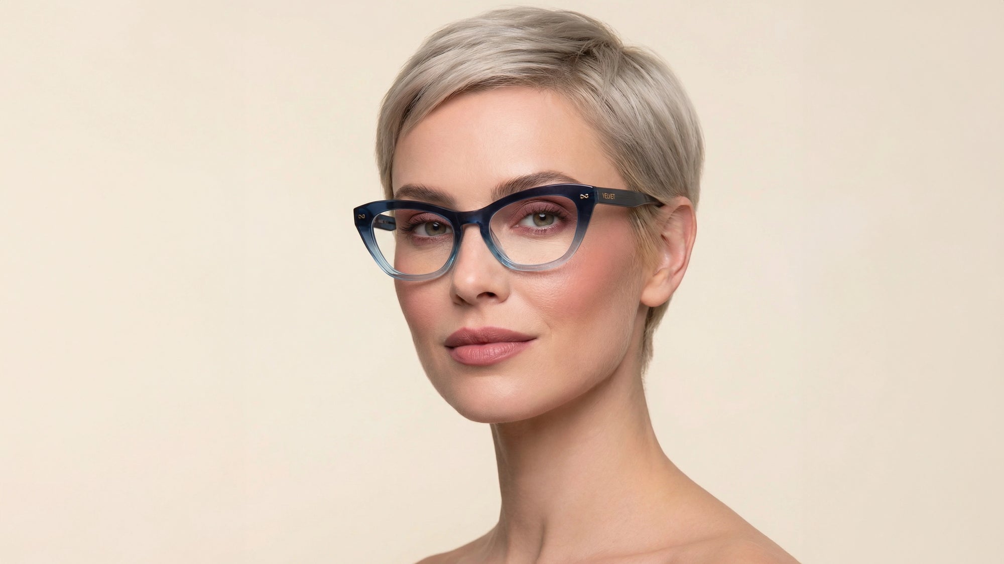 Woman wearing the Stevie optical frame by Velvet Eyewear, designed for a  round face shape